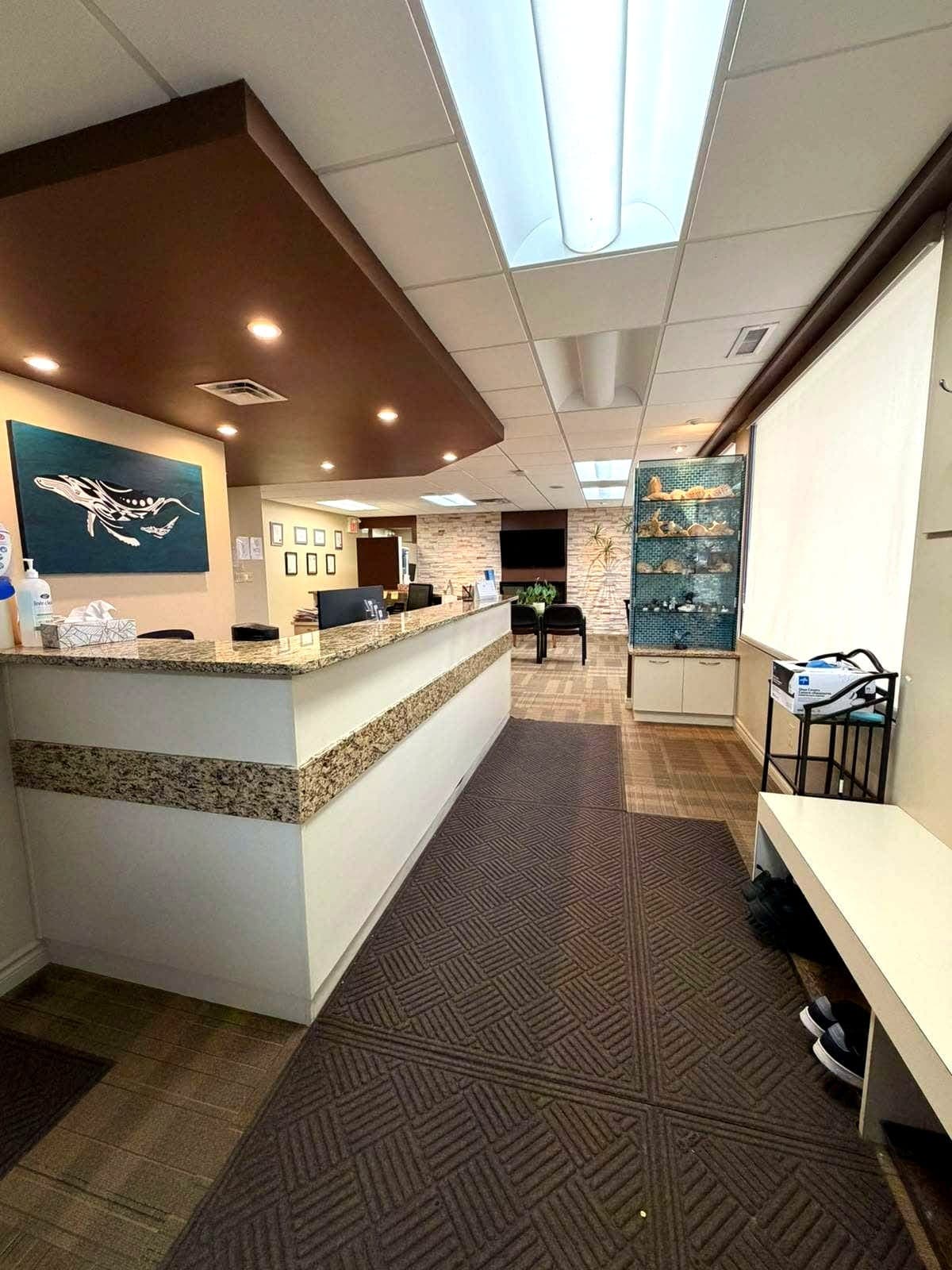 Entrance and reception area with seashell display and waiting lounge