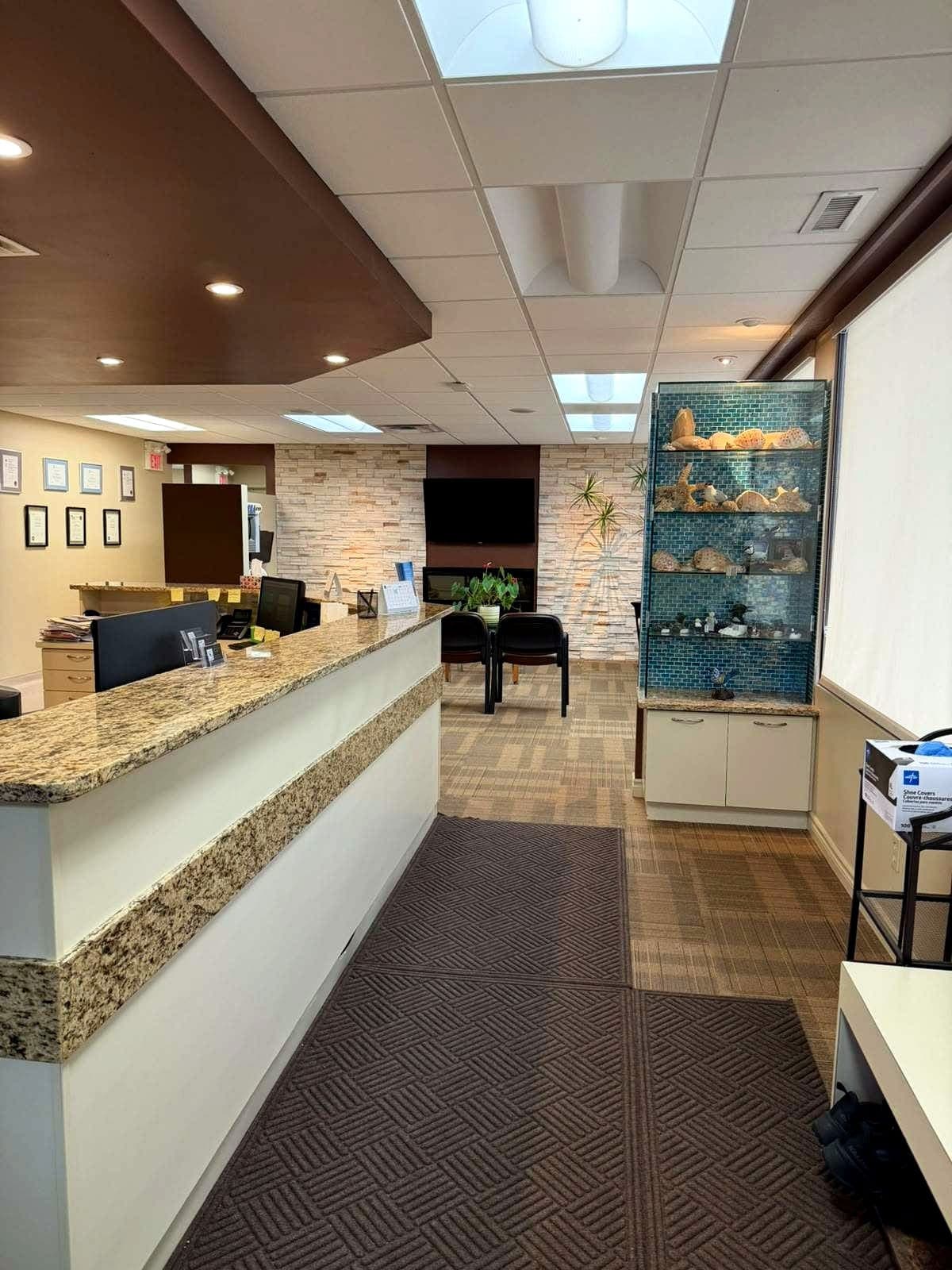 View across the reception desk toward the waiting lounge
